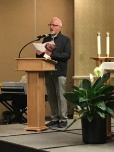 Fr. David Matz leads singing during the opening prayer service.